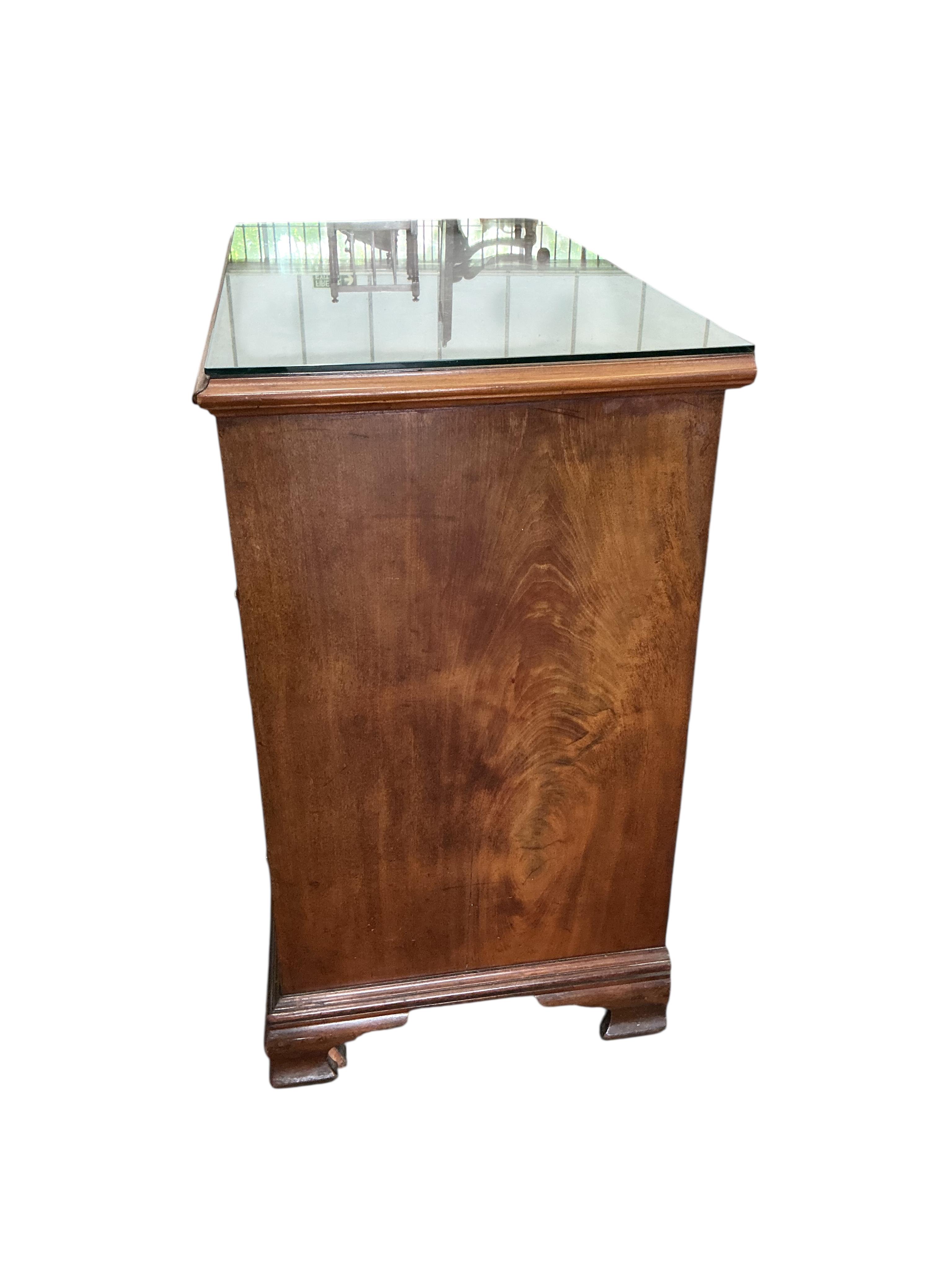 A George III mahogany chest with brushing slide, width 97cm, depth 50cm, height 86cm